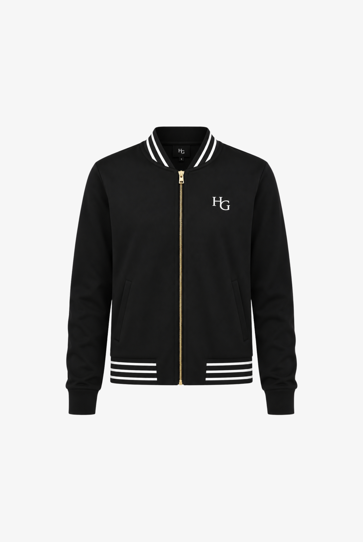 A black varsity-style jacket with a gold front zipper, white striped ribbed collar, cuffs, and hem, featuring a white embroidered 'HG' logo on the left chest, shown against a plain white background.