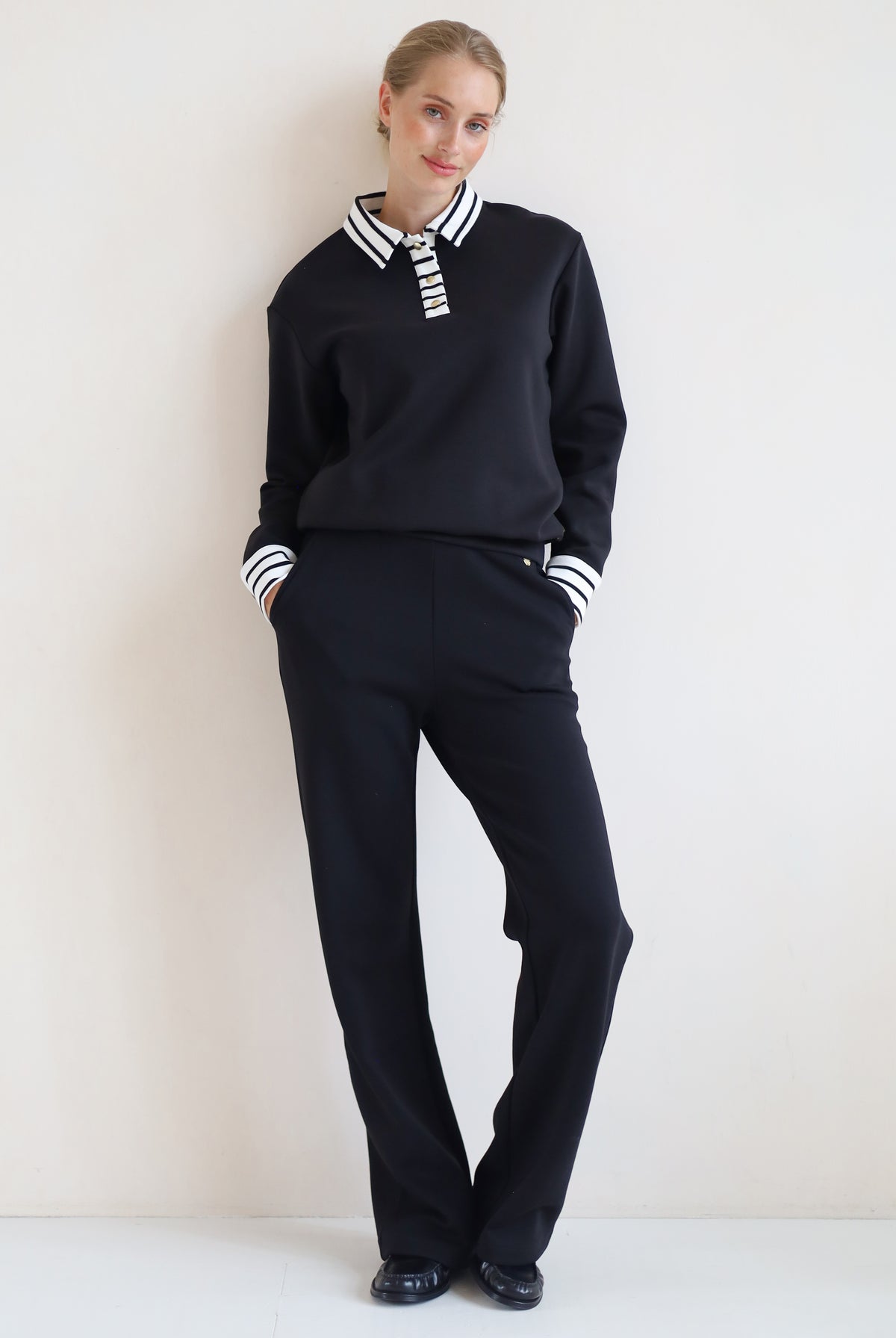 House of Gravity Button Polo Sweater in Black paired with the Wide Leg Trouser in Black