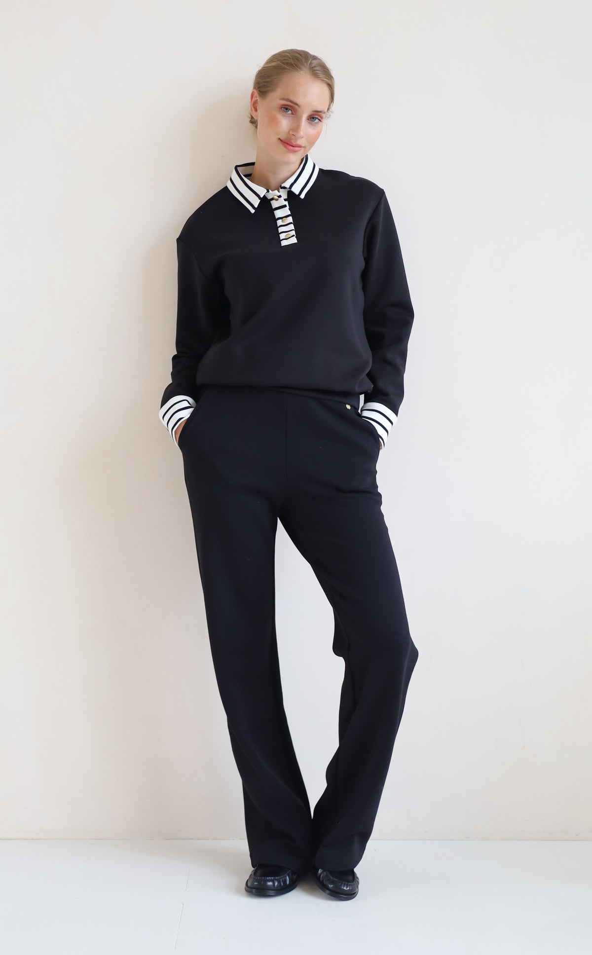 House of Gravity Button Polo Sweater in Black paired with the Wide Leg Trouser in Black