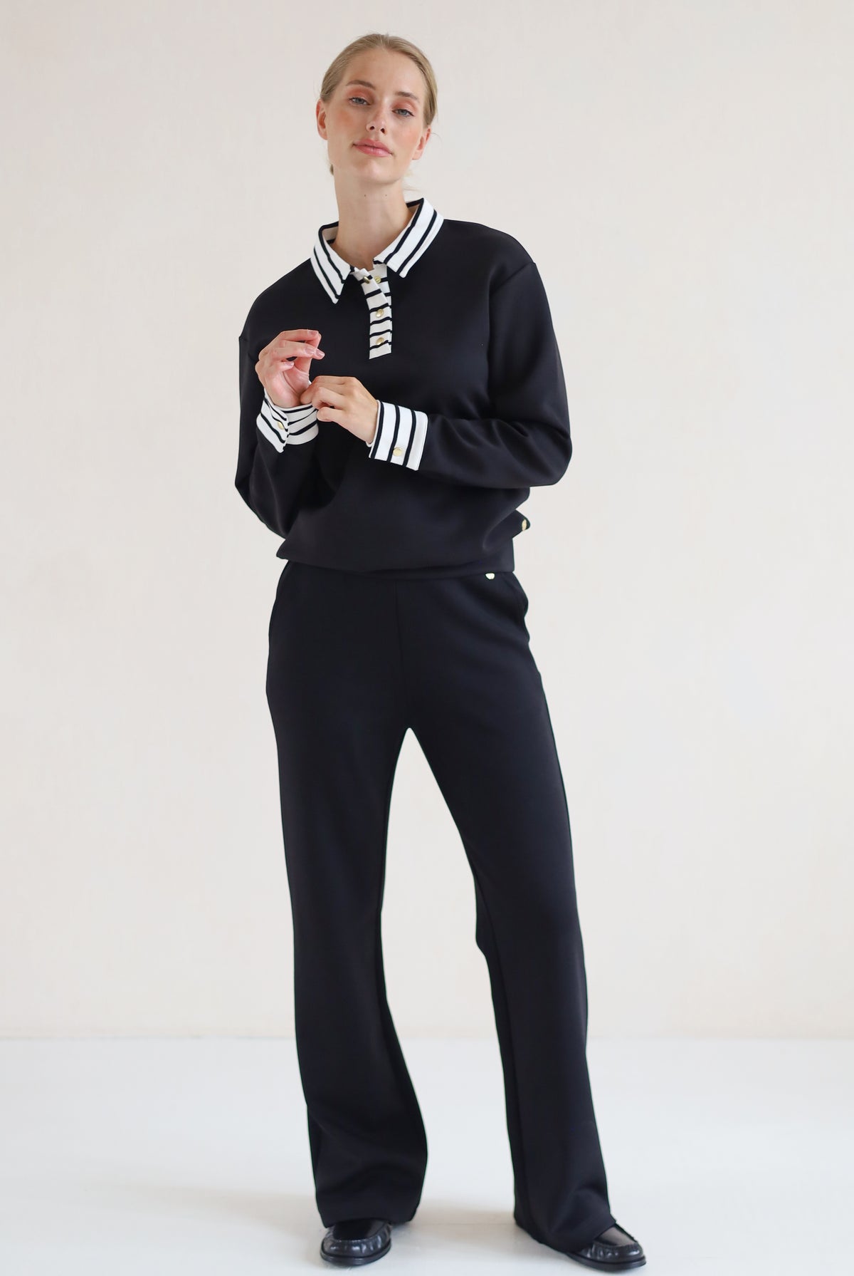 House of Gravity Button Polo Sweater in Black paired with the Wide Leg Trouser in Black
