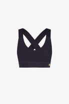 Black sports bra with criss-cross straps on a white background