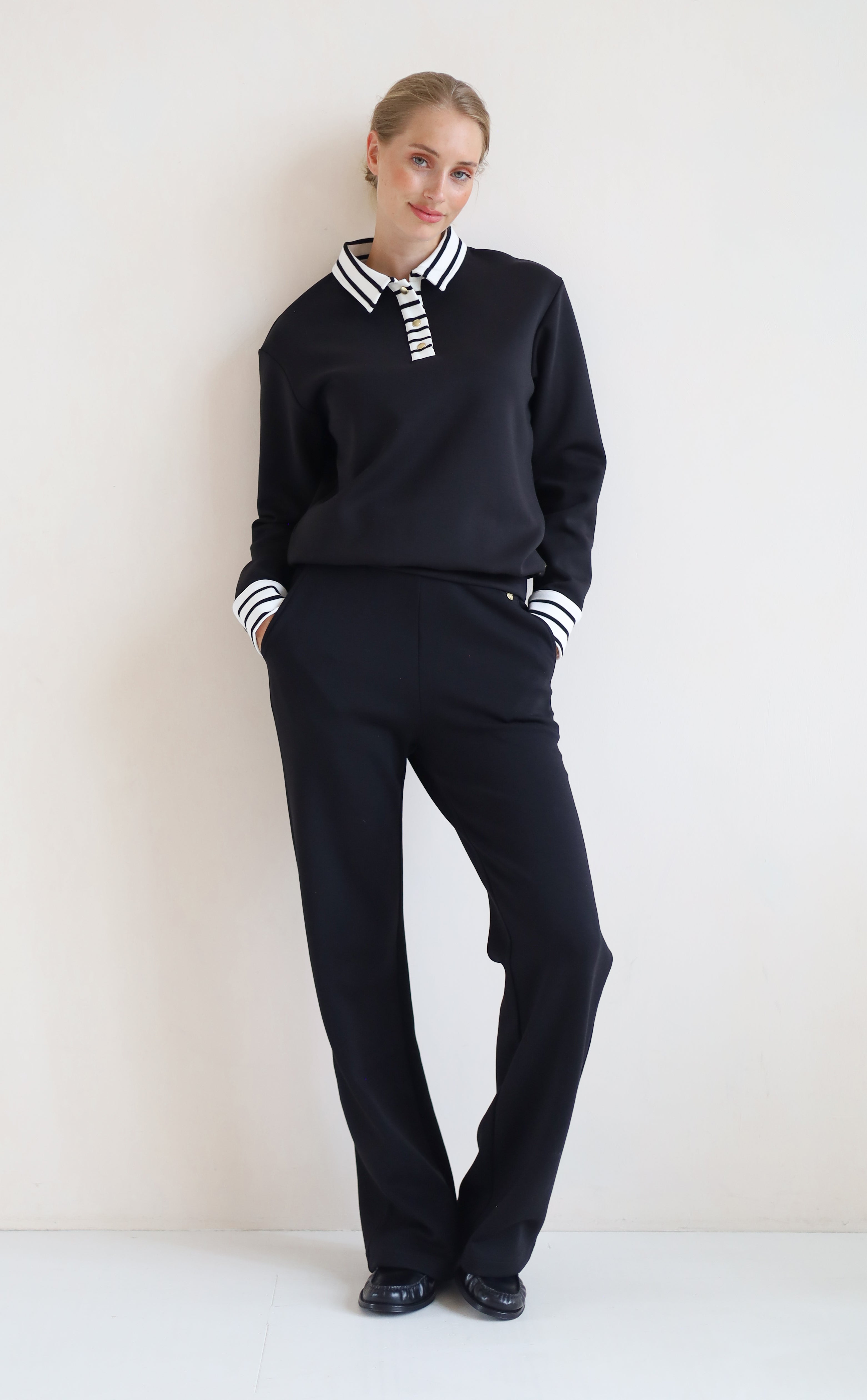 House of Gravity Button Polo Sweater in Black paired with the Wide Leg Trouser in Black