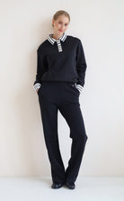 House of Gravity Button Polo Sweater in Black paired with the Wide Leg Trouser in Black