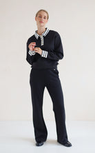 House of Gravity Button Polo Sweater in Black paired with the Wide Leg Trouser in Black
