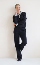 House of Gravity Button Polo Sweater in Black paired with the Wide Leg Trouser in Black